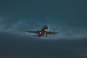 Passenger plane takes off at dusk, soon night