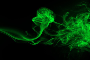Green smoke abstract on black background, darkness concept