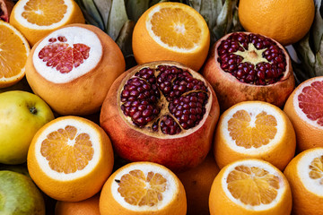Pomegranates and oranges for sale
