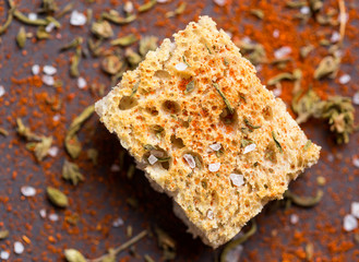 Crispy crouton with spices over wood table