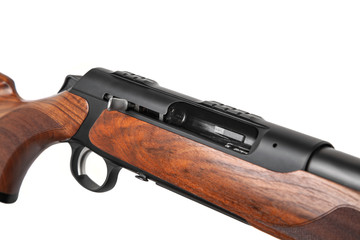 Classic semi-automatic hunting rifle with a rifled barrel and a wooden butt isolated on white