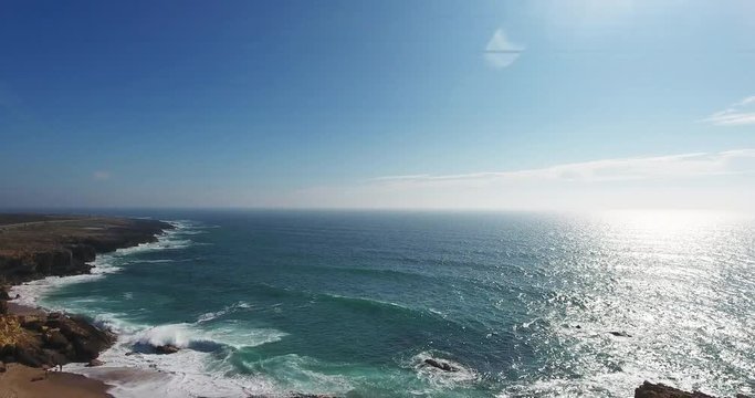 Aerial drone shot of a sunset in the sea.