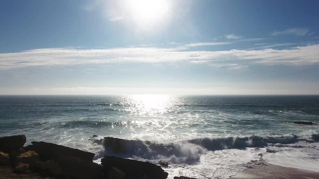 Aerial drone shot of a sunset in the sea.