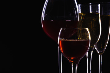 Glasses of wine in darkness