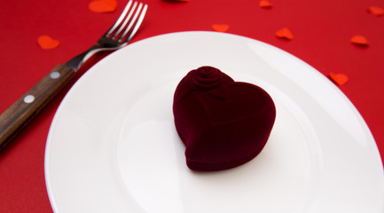 Box witha ring, table setting on a red background. Concept Valentine's Day. - Image
