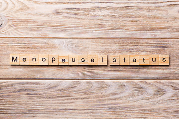 menopausal status word written on wood block. menopausal status text on wooden table for your desing, concept