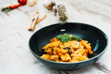 Penne gratin with vegetables, grilled zucchini and marinated tomatoes