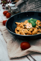 Penne gratin with vegetables, grilled zucchini and marinated tomatoes