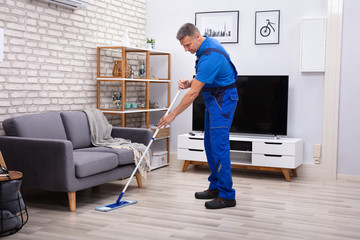 Male Janitor Mopping Floor