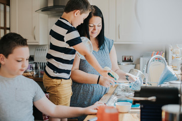 Family cleaning in the kitchen