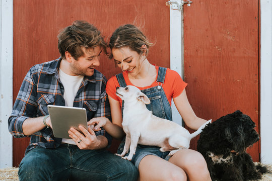 Happy couple living with their rescued dogs