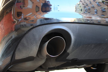 exhaust pipe of the car. Urban pollution exhaust fumes. - Image