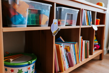 Shelves of toys and books in a nursery school