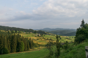 View of the Ukrainian village and the mountains. The mountain environment.