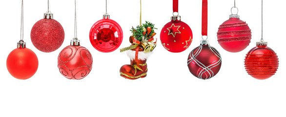 Set of hanging red christmas baubles. isolated on white background.