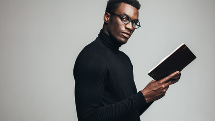 Smart young man with a book