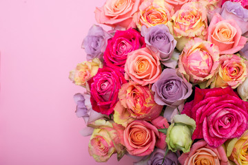 Beautiful bouquet of roses in a gift box. Bouquet of pink roses. Pink roses close-up. on pink background, with space for text.