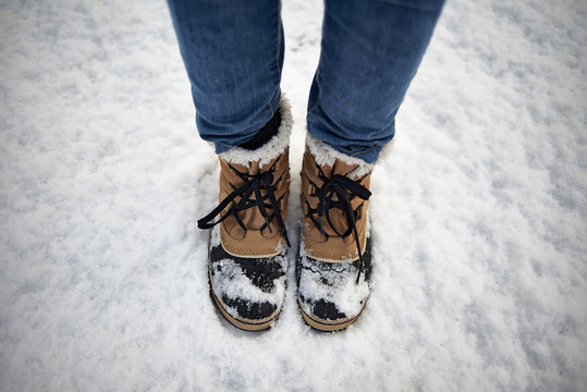 Snowboots in the snow in winter