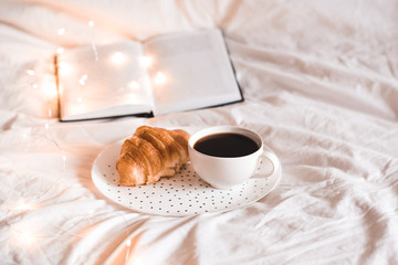 Tasty breakfast with open book closeup. Good morning.