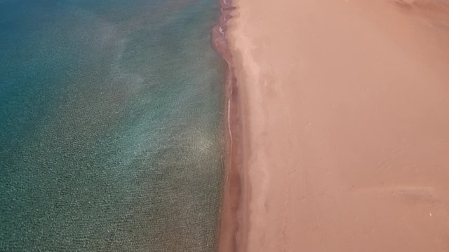 Establishing shot, sandy beach in Greece