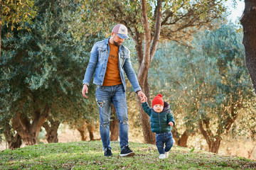 Cute little boy learning to walk