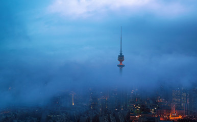 beautiful view of kuwait city on a foggy winter evening - 248129951