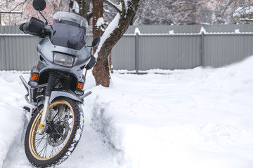 motorcycle on the snow. gloves for bad, cold weather. winter, motorcyclist, extreme ride, adventurer, adventure motorbike, copy space