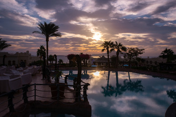 Beautiful sunrise with a view of the pool and the sea. Egypt