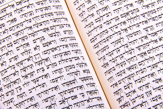 Opened hebrew Bible, isolated on white background