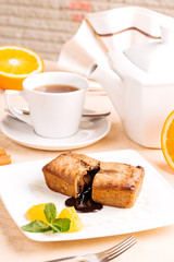 Muffin, mini cake, cup cake on a white plate with a tea
