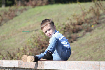 Little boy portrait in the urban park