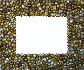 The frame created from small pebbles on a white background