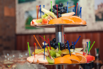 Red Christmas hat on guitar with grey background, Merry Christmas song