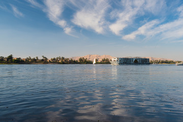 Fototapeta premium Large egyptian river cruise boat sailing on Nile