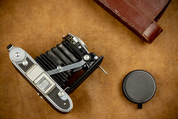 Top view of vintage camera on colorful background