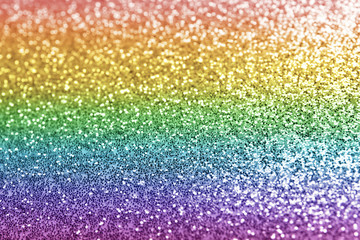 Composition of sparkling rainbow glitter as background