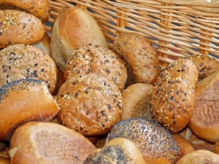fresh bread rolls or buns in a basket