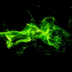 Green smoke on black background