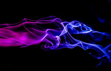 Colored smoke on black background