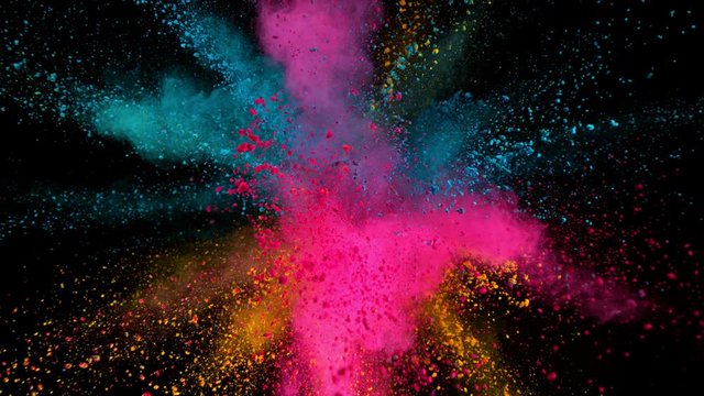 Super slowmotion shot of color powder explosions isolated on black background. Shot with high speed cinema camera at 1000fps