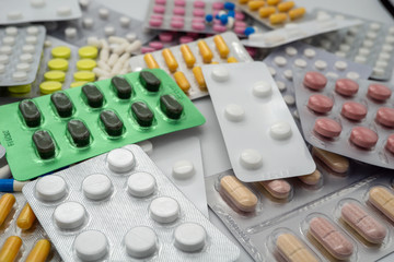 Different medicines: tablets, pills in blister pack, medications drugs, vitamins, macro, selective...