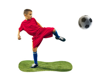 Young boy kicks the soccer ball. Isolated photo on white background. Football player in motion at studio. Fit jumping boy in action, jump, movement at game.