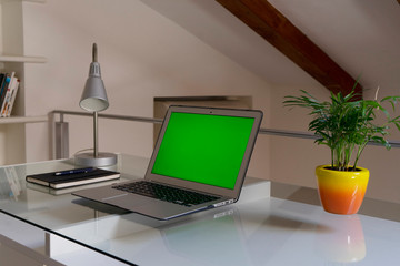 Home office hands typing at laptop