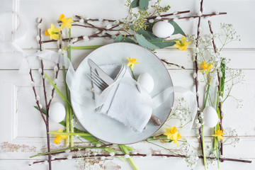 Easter place setting on white vintage background