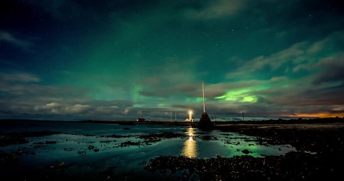 Northern lights timelapse with light house, wides shot