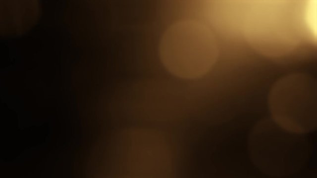 gold yellow bokeh particles background