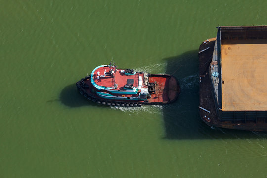 Tugboat Pulling a Barge
