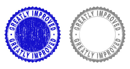 Grunge GREATLY IMPROVED stamp seals isolated on a white background. Rosette seals with distress texture in blue and grey colors.