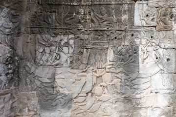 carvings on a wall in Angkor Thom temple showing everyday scenes, Siem Reap, Cambodia, Asia