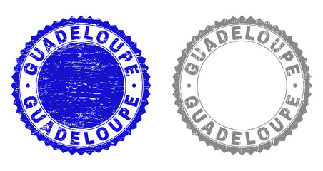 Grunge GUADELOUPE stamp seals isolated on a white background. Rosette seals with grunge texture in blue and grey colors. Vector rubber stamp imprint of GUADELOUPE caption inside round rosette.